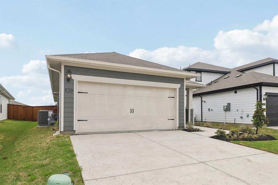 Front exterior of a new home in Lakehaven - Spring Series, Farmersville, TX, highlighting curb appeal (Image 20). Front exterior of a new home in Lakehaven - Spring Series, Farmersville, TX, highlighting curb appeal (Image 20).