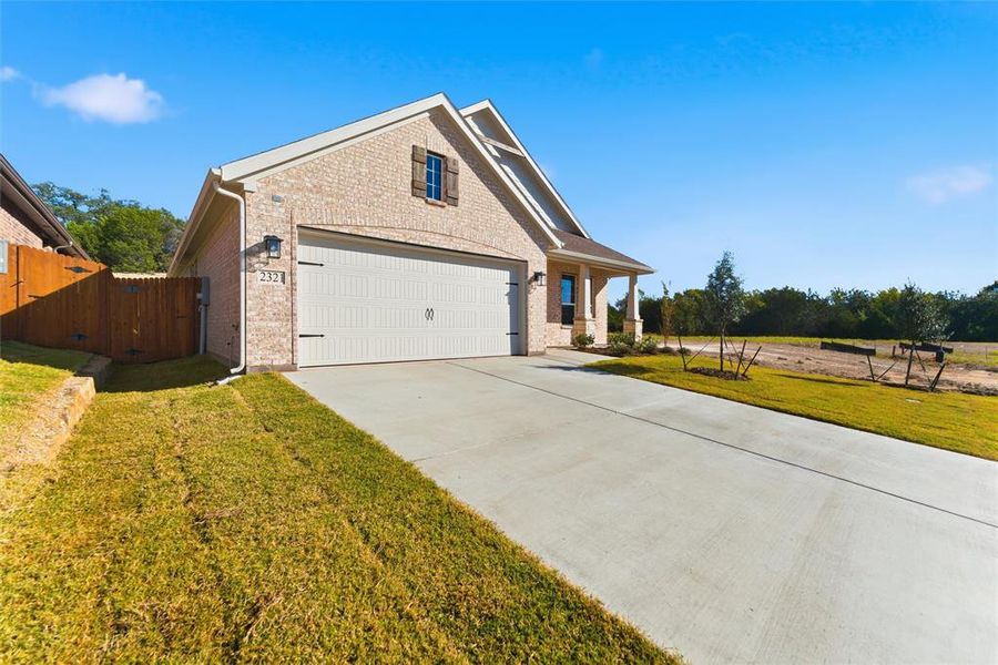 Front exterior of a new home in Waterford Park, Weatherford, TX, highlighting curb appeal (Image 20).
