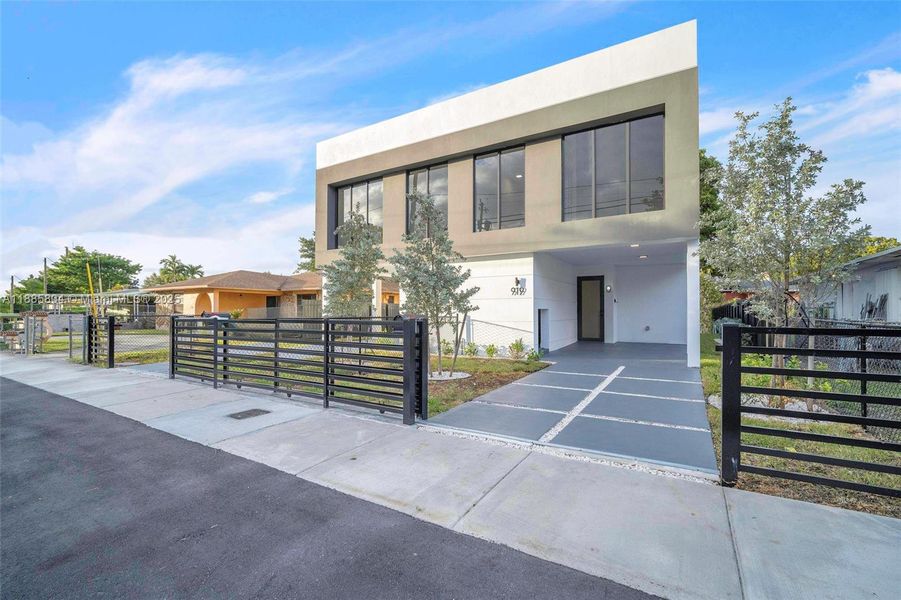 Front exterior of a new home in , Miami, FL, highlighting curb appeal (Image 1).