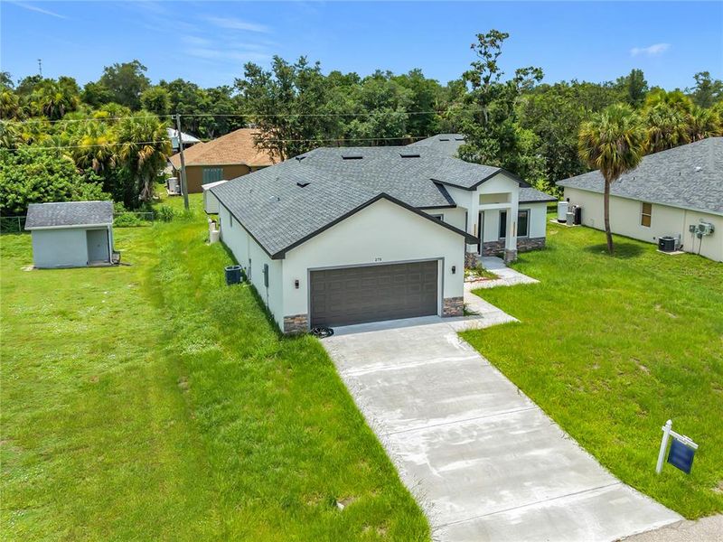 Front exterior of a new home in , Port Charlotte, FL, highlighting curb appeal (Image 26). Front exterior of a new home in , Port Charlotte, FL, highlighting curb appeal (Image 26).