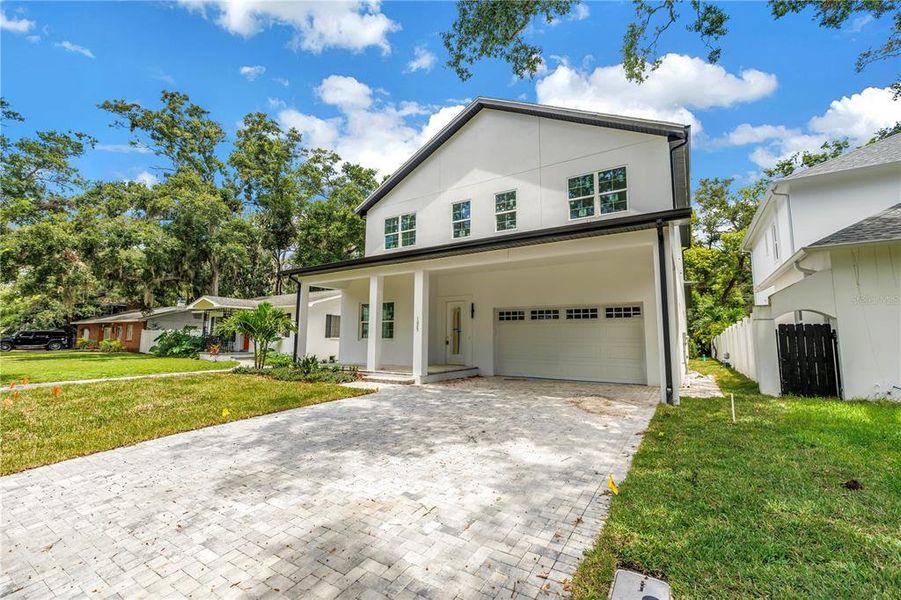 Front exterior of a new home in , St. Petersburg, FL, highlighting curb appeal (Image 2).