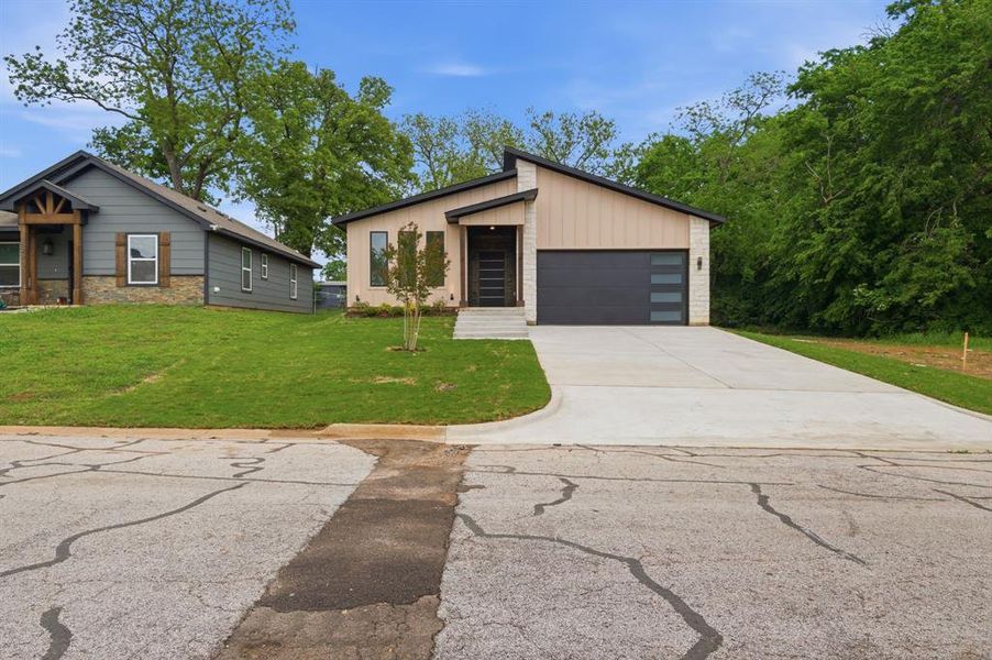 Front exterior of a new home in , Denison, TX, highlighting curb appeal (Image 22).