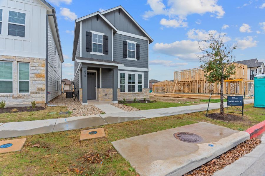 Front exterior of a new home in Retreat at Hero Way, Leander, TX, highlighting curb appeal (Image 1).