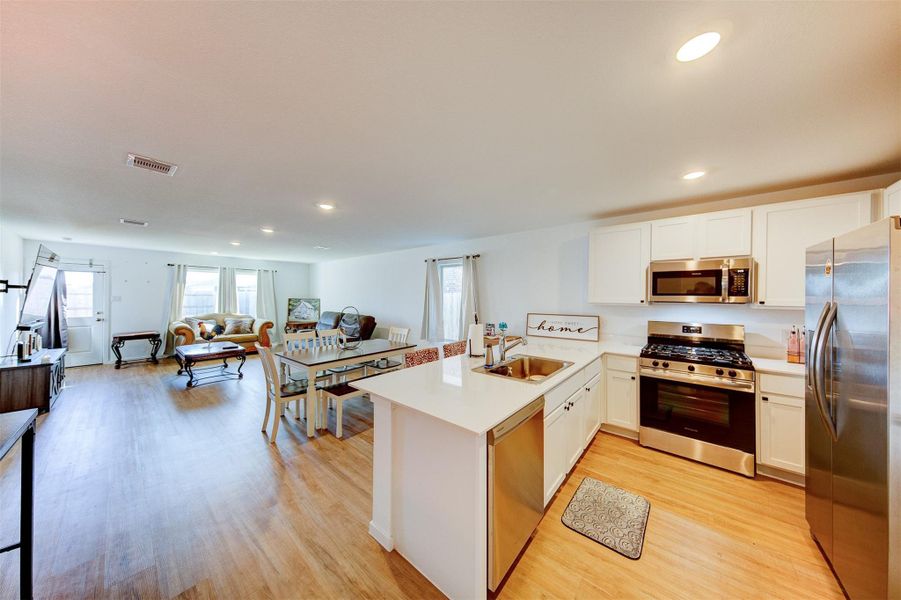 The kitchen is open to the dining room and living room.