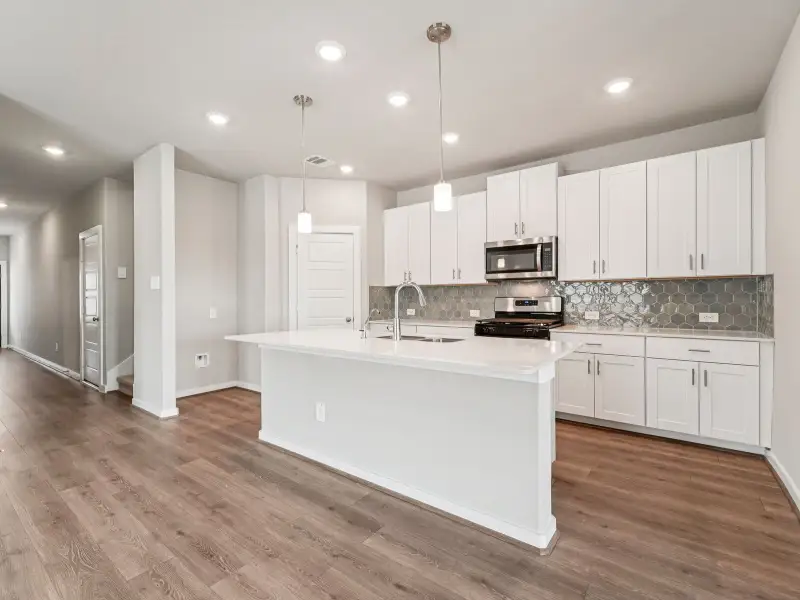 Furnished interior view inside a new home in Heights of Barbers Hill, Mont Belvieu (Image 4).
