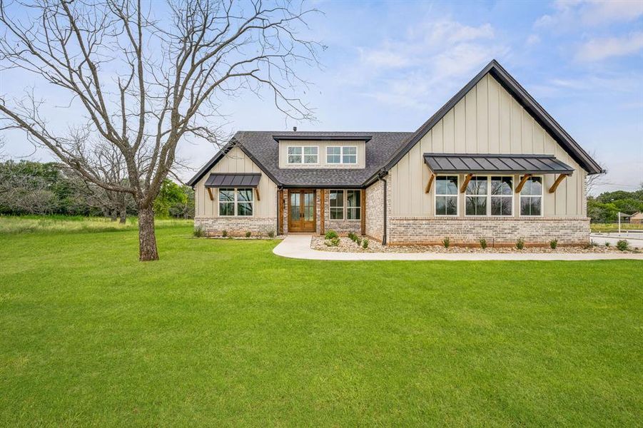 View of front of house featuring a front lawn