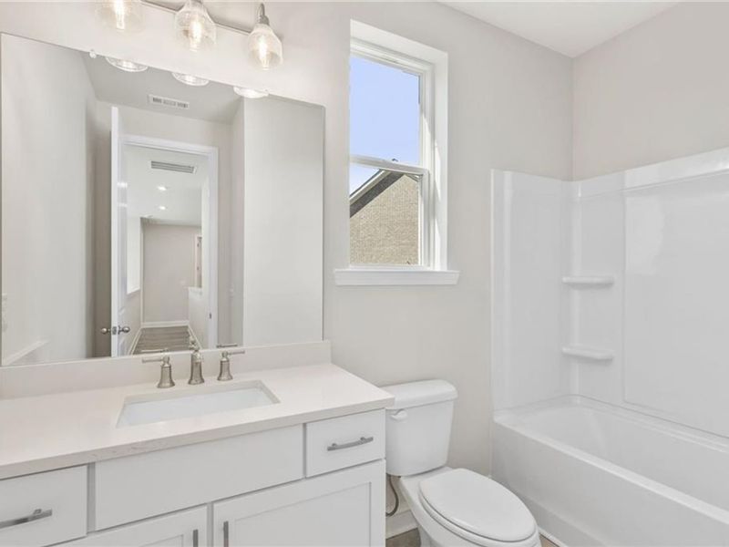 Furnished interior view inside a new home in Melody Lakeside Estates, Buford (Image 17).