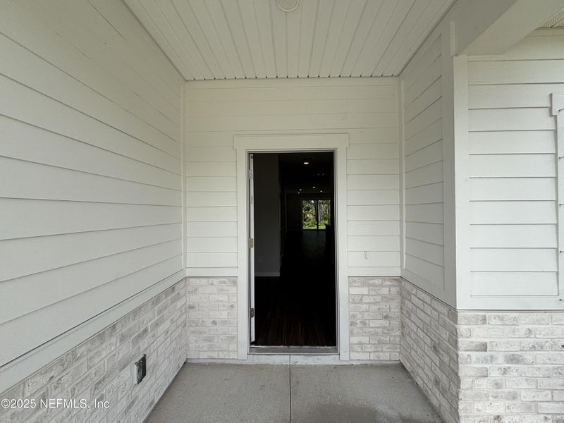 Exterior details and patio area of a home in The Magnolia Series at Reserve East, Flagler Beach (Image 3).