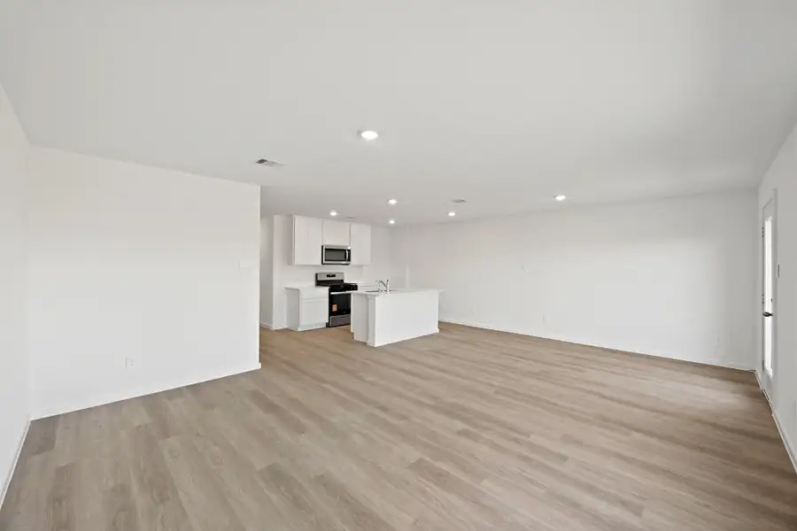 Spacious, unfurnished interior of a new home in The Canopies, Splendora (Image 9).