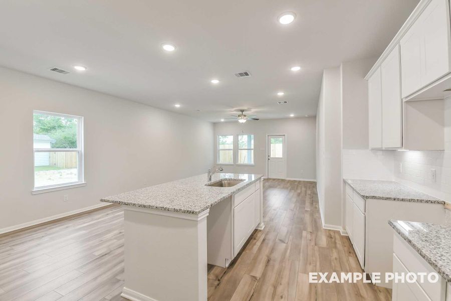 Furnished interior view inside a new home in Caney Creek Place, Conroe (Image 3).