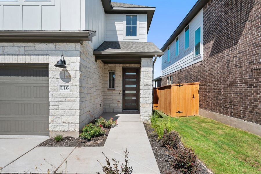 Exterior details and patio area of a home in Terrace Collection at Lariat, Liberty Hill (Image 3).