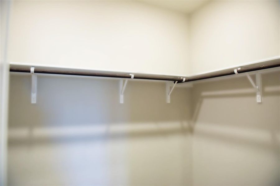 Walk-in closet in Primary Bedroom Walk-in closet in Primary Bedroom