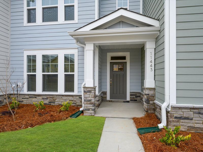 Exterior details and patio area of a home in North Creek Village - Townhomes, Huntersville (Image 20).