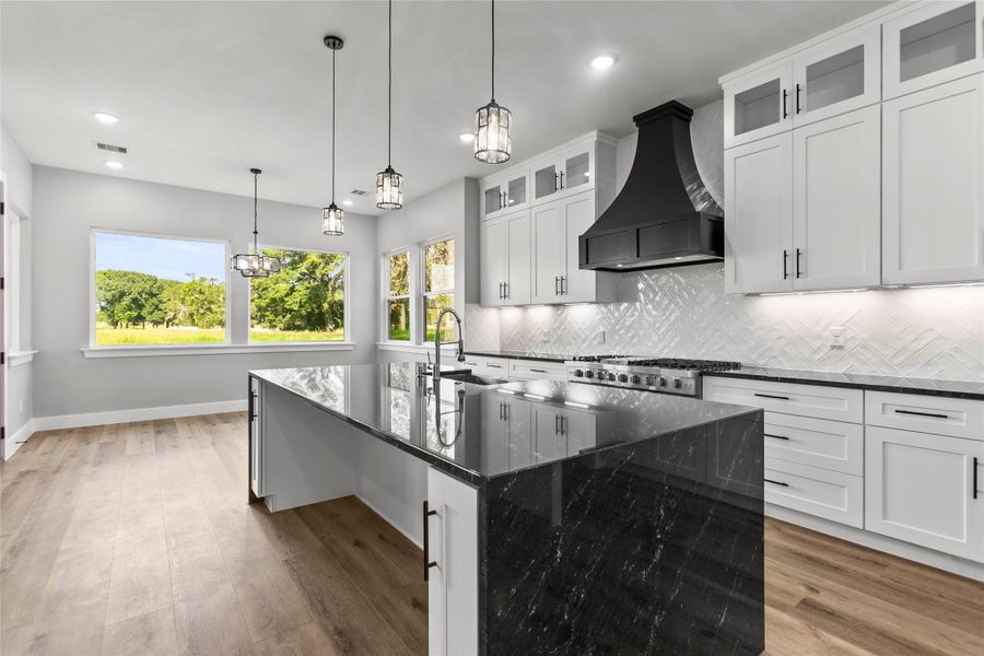 The large chef’s kitchen features stainless steel appliances including a double oven gas range, plenty of counter and cabinet space and a large walk-in pantry for all of your culinary needs. The large chef’s kitchen features stainless steel appliances including a double oven gas range, plenty of counter and cabinet space and a large walk-in pantry for all of your culinary needs.