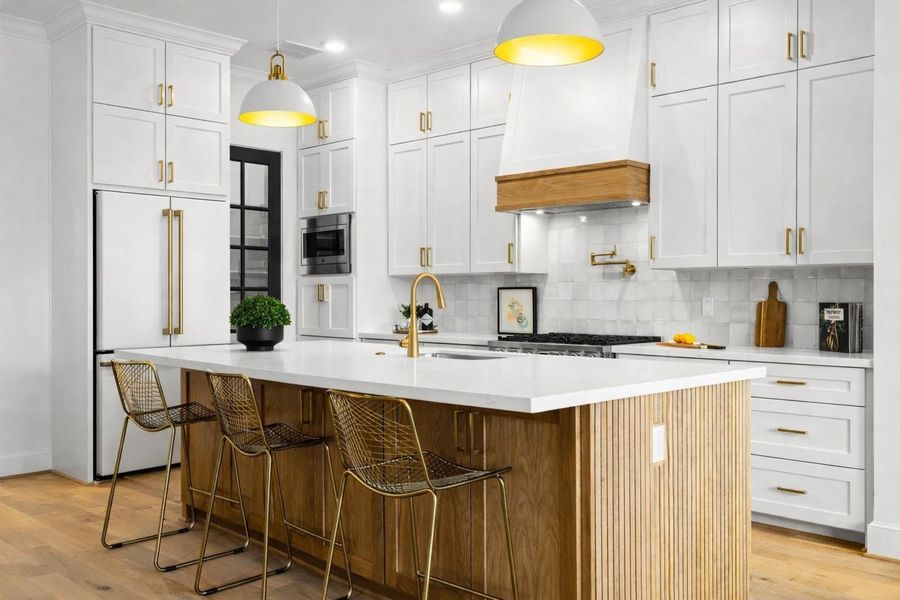 Custom cabinetry beneath the island offers thoughtful extra storage, ideal for organizing entertaining pieces or setting up dedicated areas for guests.