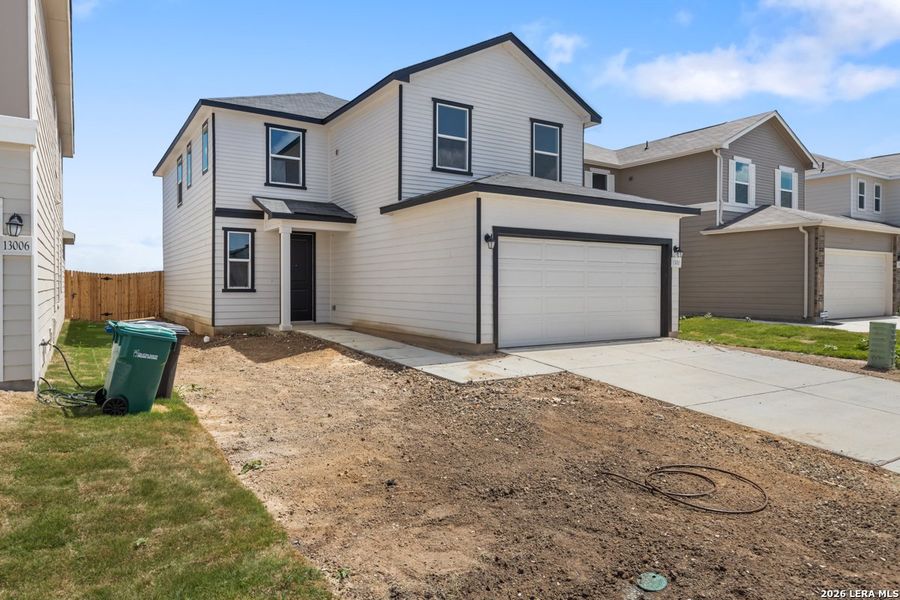Front exterior of a new home in Medina Crossing, Von Ormy, TX, highlighting curb appeal (Image 21).