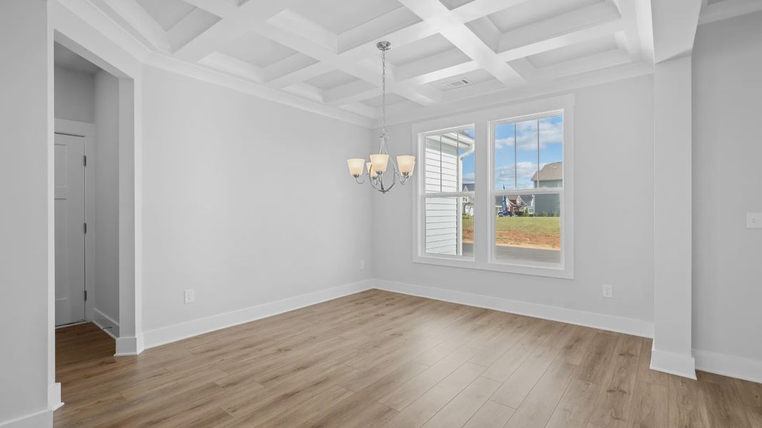 2 story single family home, all white, dining room