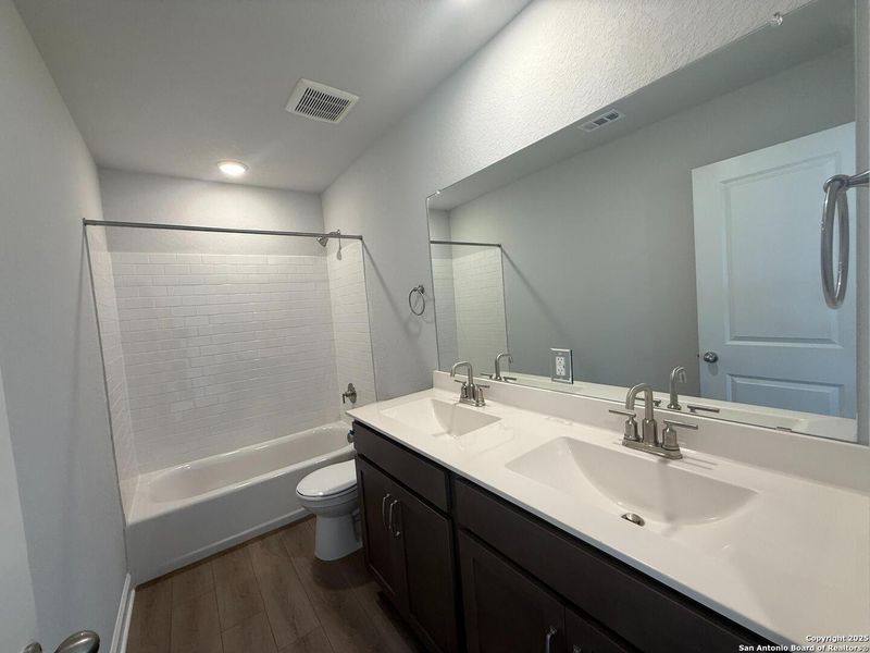 Furnished interior view inside a new home in The Summit at Saddlebrook Ranch 55's, Schertz (Image 11).