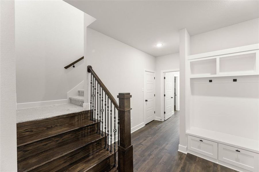 Mudroom featuring dark wood-style flooring and recessed lighting Mudroom featuring dark wood-style flooring and recessed lighting