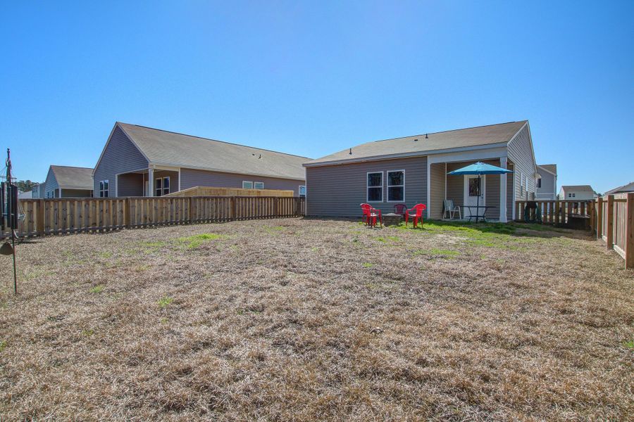 Front exterior of a new home in Pender Woods at Cane Bay, Summerville, SC, highlighting curb appeal (Image 21).