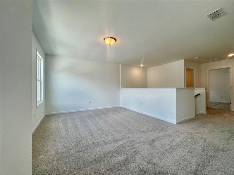 Spacious, unfurnished interior of a new home in Eastlyn Crossing, Flowery Branch (Image 26).