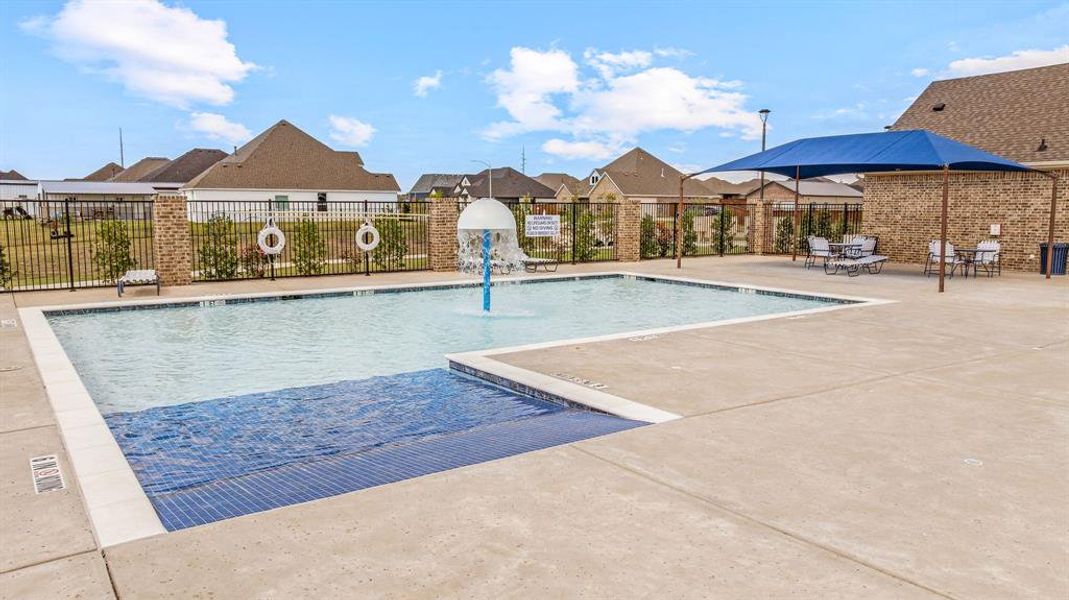 Community pool featuring a residential view and a patio