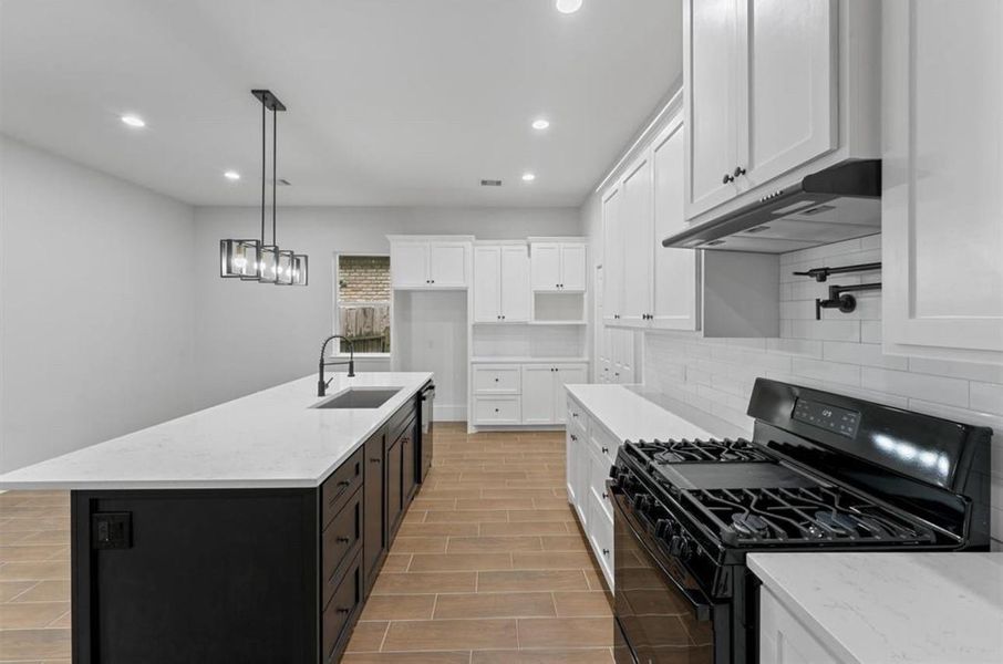 Modern kitchen featuring sleek cabinetry, ample counter space and open layout. Modern kitchen featuring sleek cabinetry, ample counter space and open layout.