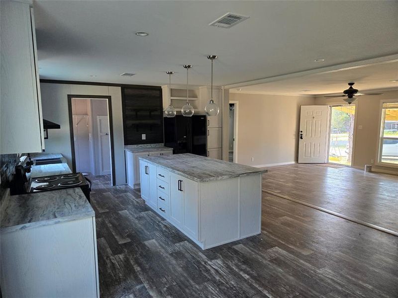 Furnished interior view inside a new home in , Pelican Bay (Image 7).