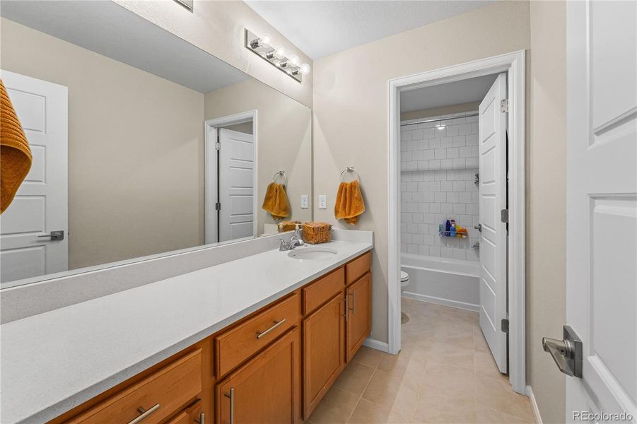 Bathrooms: Modern upper-level baths with storage.