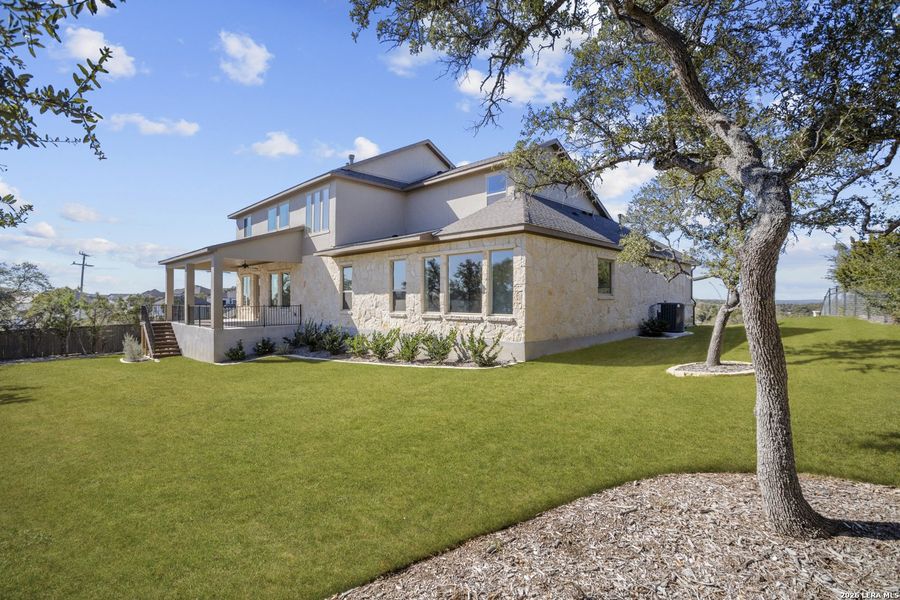 Exterior details and patio area of a home in Highland Estates, San Antonio (Image 22).