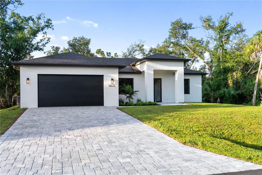 Front exterior of a new home in , Port Charlotte, FL, highlighting curb appeal (Image 33).