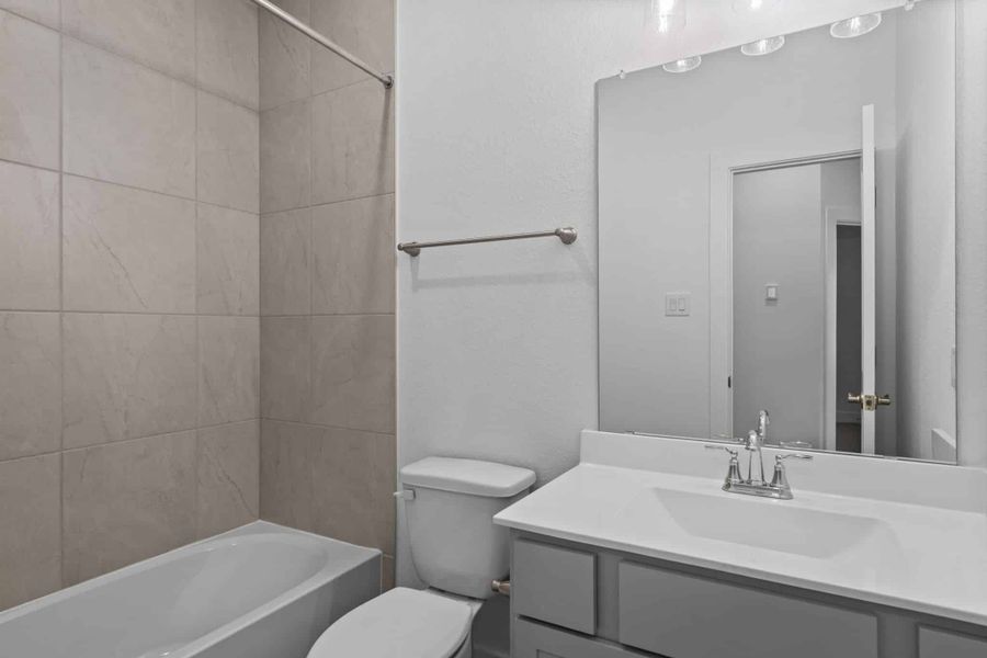 Furnished interior view inside a new home in Meridiana, Iowa Colony (Image 8).