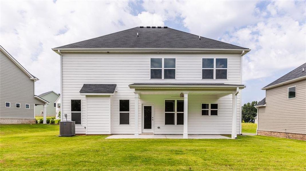 Exterior details and patio area of a home in Evergreen Crossing, Locust Grove (Image 2).