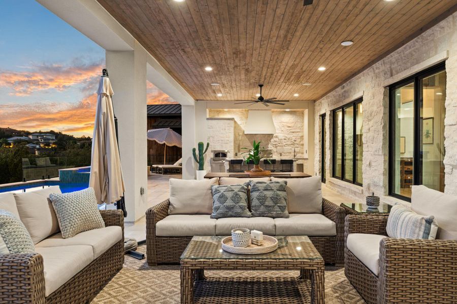 View of patio / terrace with a ceiling fan, a pool with connected hot tub, outdoor dining space, and an outdoor hangout area View of patio / terrace with a ceiling fan, a pool with connected hot tub, outdoor dining space, and an outdoor hangout area