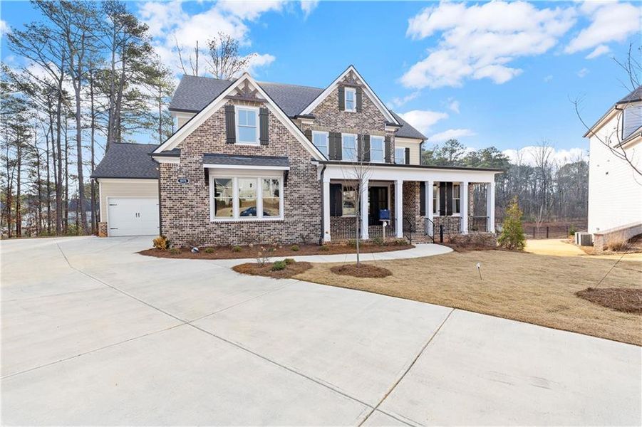 Front exterior of a new home in , Powder Springs, GA, highlighting curb appeal (Image 2). Front exterior of a new home in , Powder Springs, GA, highlighting curb appeal (Image 2).