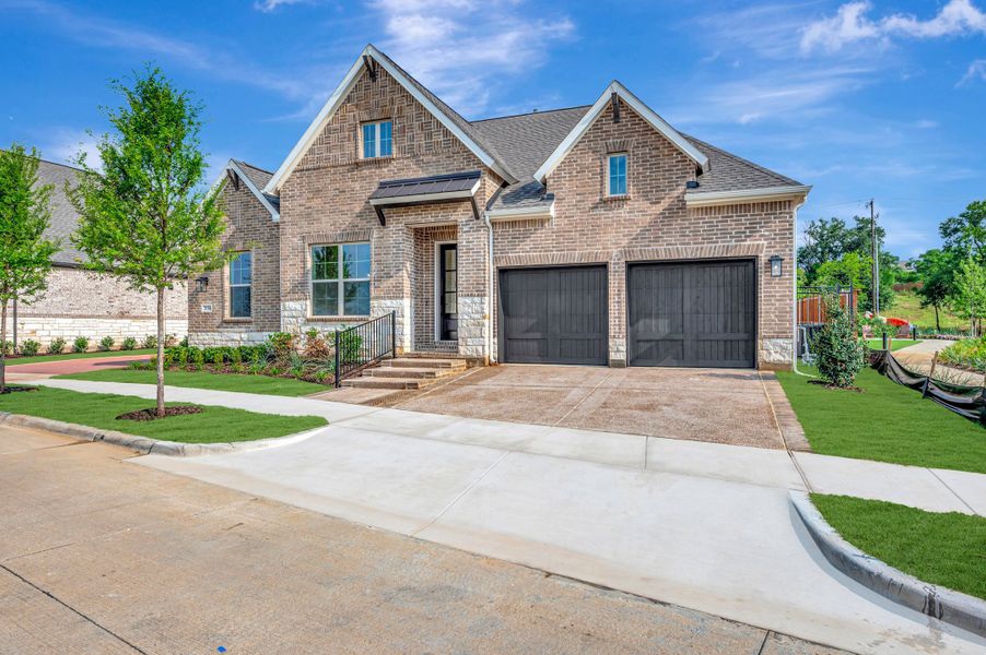 Front exterior of a new home in Elements at Viridian - Garden Series, Arlington, TX, highlighting curb appeal (Image 24). Front exterior of a new home in Elements at Viridian - Garden Series, Arlington, TX, highlighting curb appeal (Image 24).