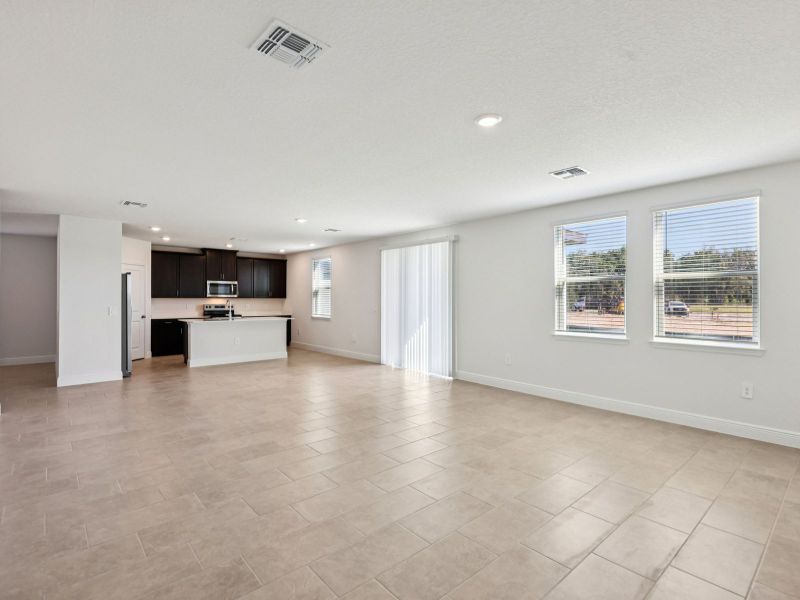 Spacious, unfurnished interior of a new home in The Reserve at Hammock Oaks - Signature Series, Lady Lake (Image 9).