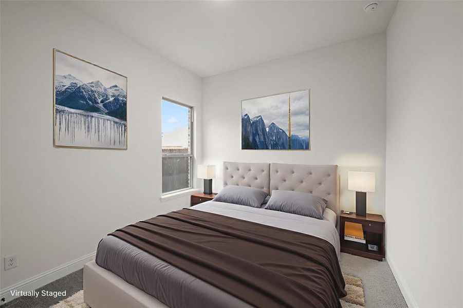 Bedroom with carpet flooring and baseboards Bedroom with carpet flooring and baseboards