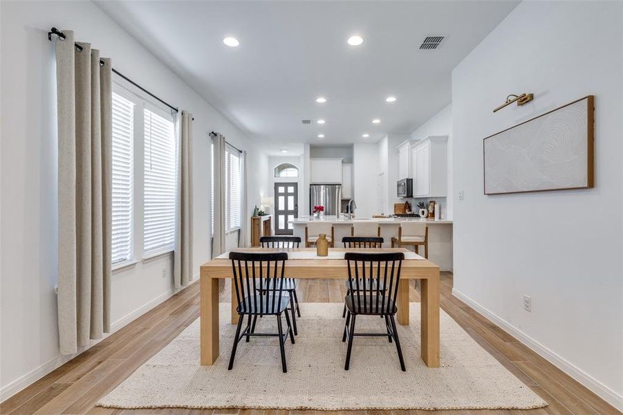 Dining room featuring recessed lighting and light wood-type flooring
