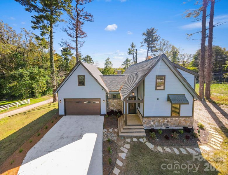 Front exterior of a new home in , Hendersonville, NC, highlighting curb appeal (Image 17).