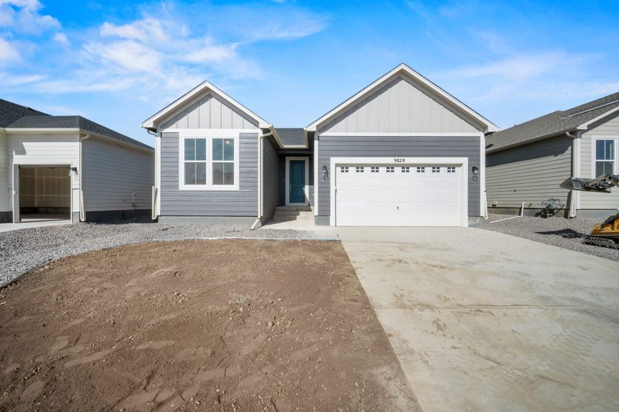 Front exterior of a new home in The Glen-12, Colorado Springs, CO, highlighting curb appeal (Image 26).