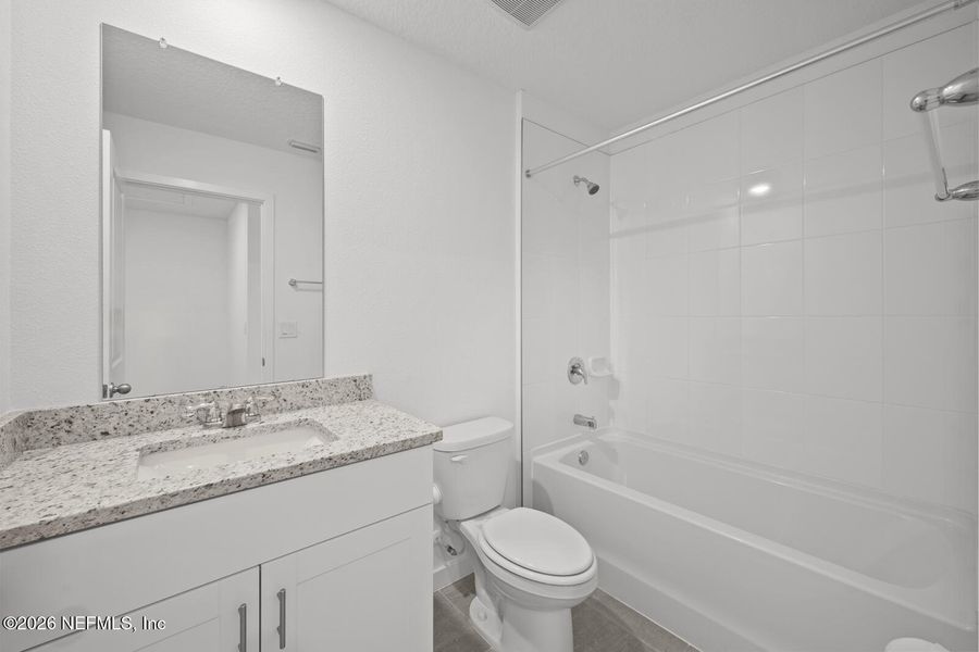 Furnished interior view inside a new home in Lakes at Bella Lago – Classic Series, Green Cove Springs (Image 10).