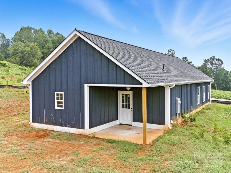 Front exterior of a new home in , Clover, SC, highlighting curb appeal (Image 23).