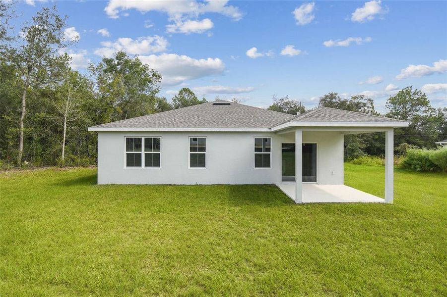 Exterior details and patio area of a home in Aspire at Citrus Springs, Citrus Springs (Image 2).