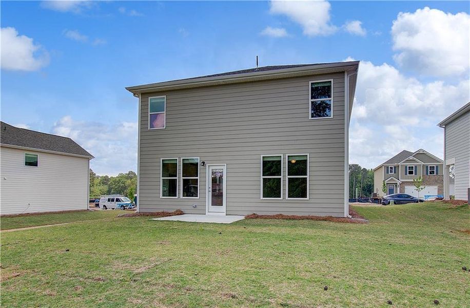 Exterior details and patio area of a home in Enclave at Evergreen, Fairburn (Image 22).