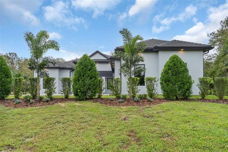 Front exterior of a new home in , Kissimmee, FL, highlighting curb appeal (Image 24). Front exterior of a new home in , Kissimmee, FL, highlighting curb appeal (Image 24).