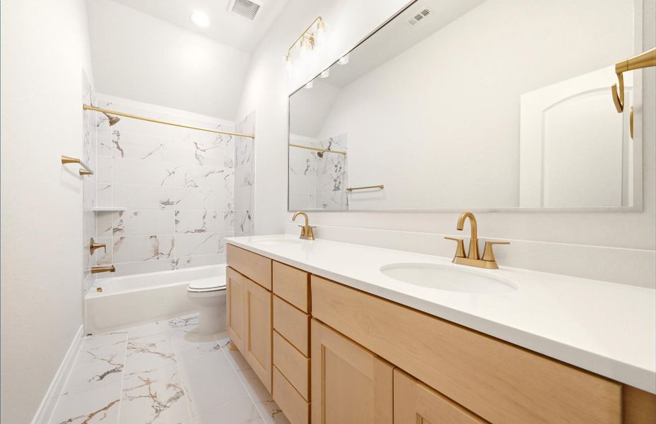 Furnished interior view inside a new home in The Woodlands Hills 65′, Willis (Image 11).