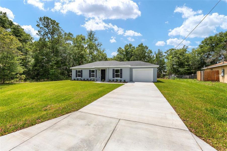 Front exterior of a new home in , Ocala, FL, highlighting curb appeal (Image 18).