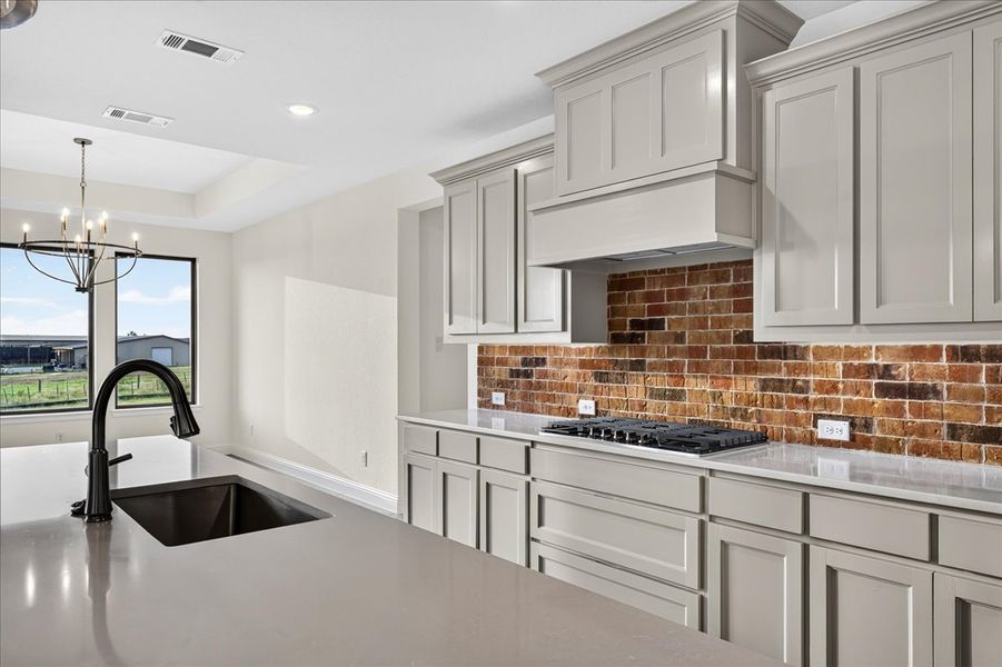 Doug Parr Homes | Brick Backsplash and Under-Cabinet Lighting