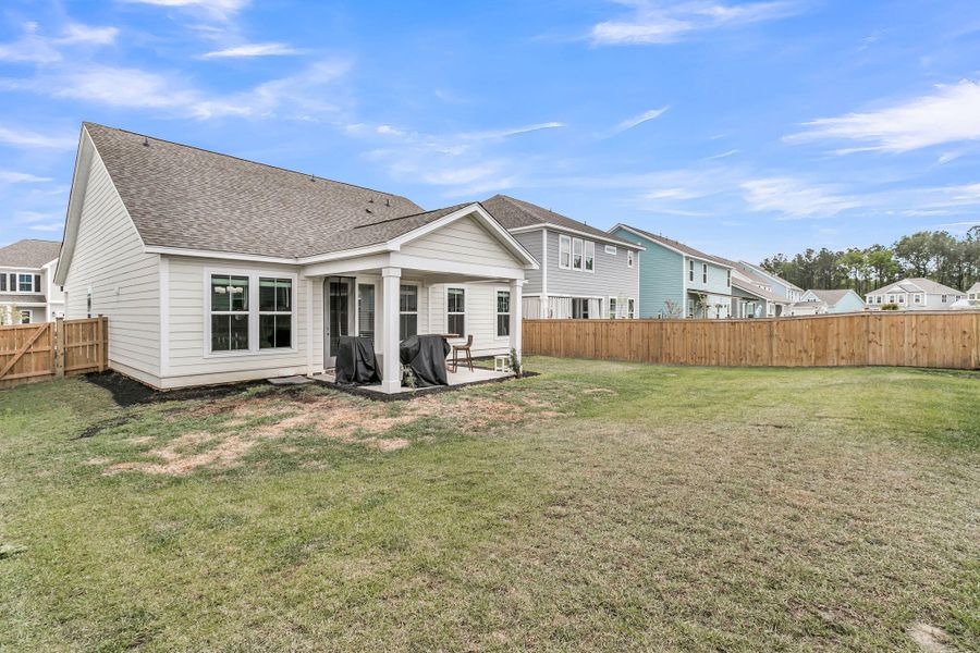 Exterior details and patio area of a home in High Point at Foxbank, Moncks Corner (Image 33).